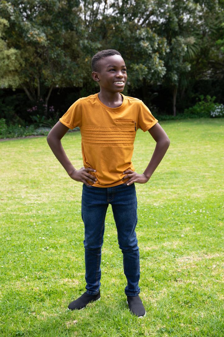 Youth Embracing Nature with Smiling Optimism on Sunny Lawn