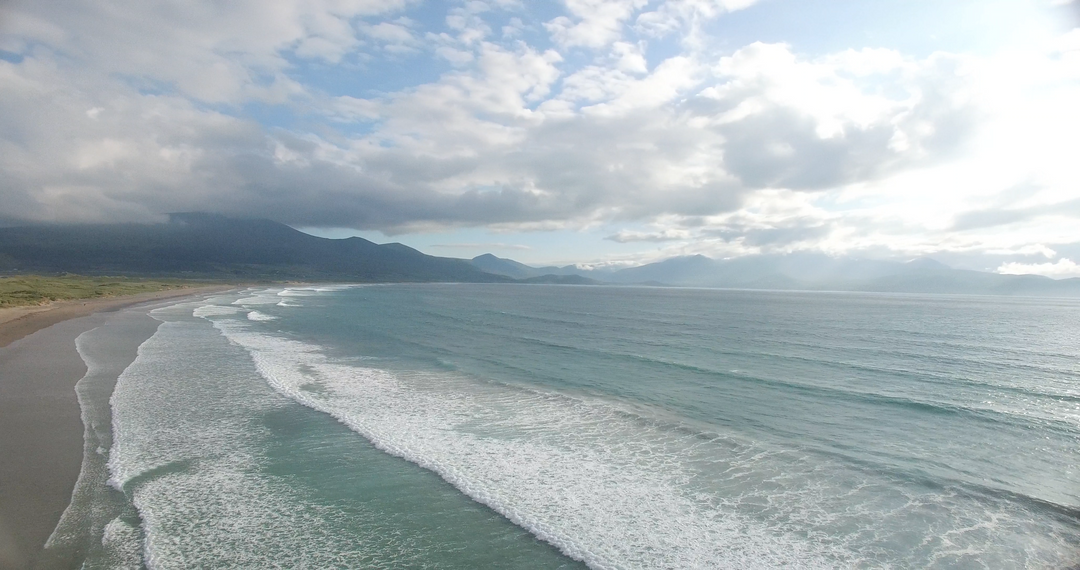 Transparent Blue Waves Hitting Scenic Beach Under Bright Cloudy Sky - Download Free Stock Images Pikwizard.com