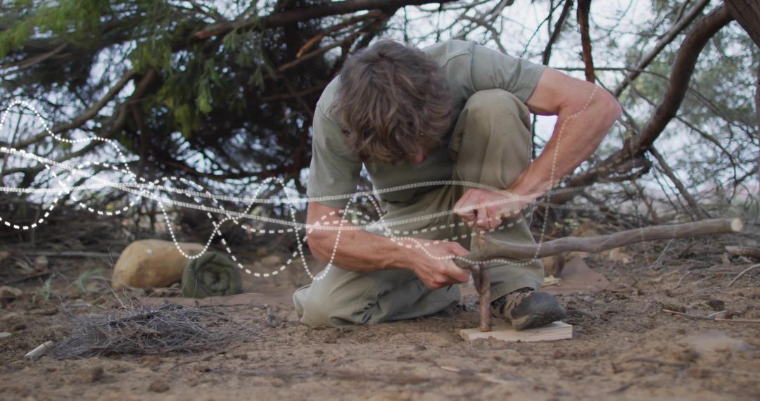 Man Practicing Wilderness Survival Skills in Outdoors