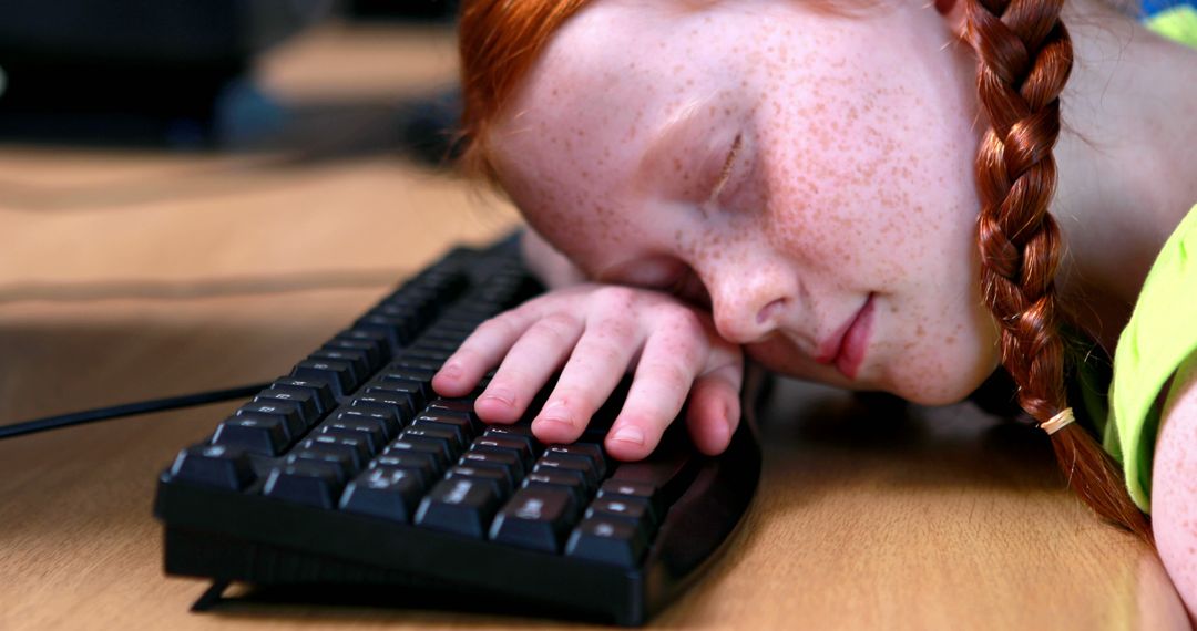 Tired Child Falling Asleep on Keyboard at Desk - Free Images, Stock Photos and Pictures on Pikwizard.com