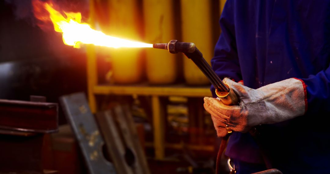 Industrial Worker Using Welding Torch in Factory - Free Images, Stock Photos and Pictures on Pikwizard.com