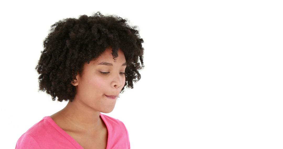 Thoughtful Young African American Woman Wearing Pink Isolated on White Background - Free Images, Stock Photos and Pictures on Pikwizard.com