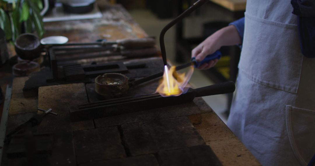 Craftsperson Using Blowtorch for Metalwork in Workshop - Free Images, Stock Photos and Pictures on Pikwizard.com