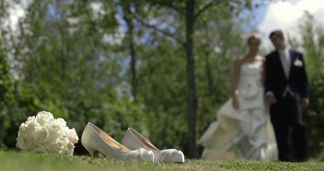 Wedding Scene with Bride and Groom in Background Focuses on Bridal Shoes - Free Images, Stock Photos and Pictures on Pikwizard.com