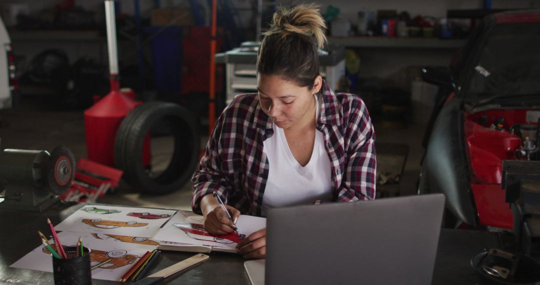 Female Artist Designing Car Concepts in Workshop - Free Images, Stock Photos and Pictures on Pikwizard.com