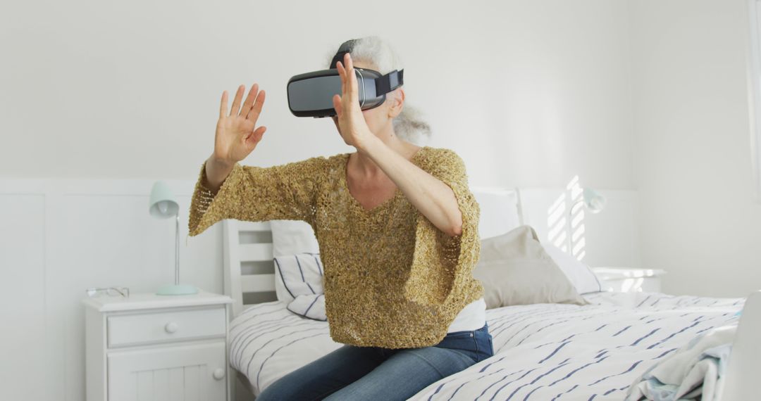 Senior Woman Experiencing Virtual Reality at Home - Free Images, Stock Photos and Pictures on Pikwizard.com