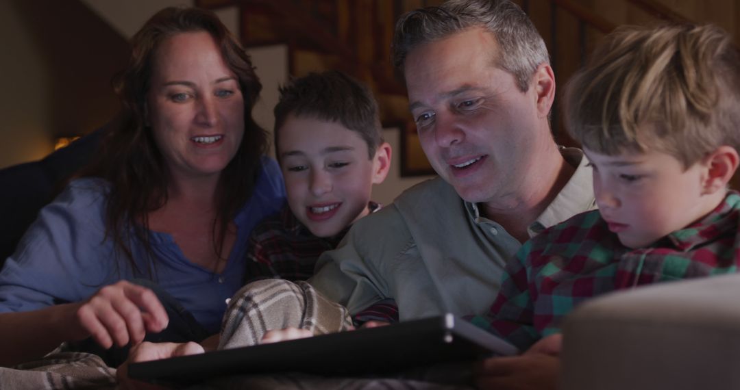 Family Using Digital Tablet Together in Cozy Living Room - Free Images, Stock Photos and Pictures on Pikwizard.com