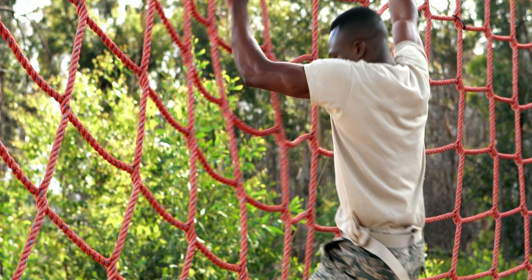 Determined Military Soldier Tackling Obstacle Course Challenge