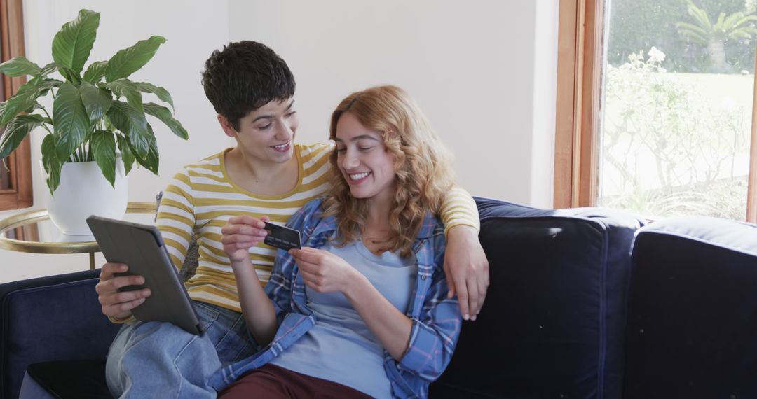 Happy Couple Using Digital Technology for Online Shopping