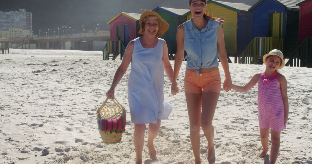 Three Generations of Women Enjoying Sunny Day at the Beach - Free Images, Stock Photos and Pictures on Pikwizard.com