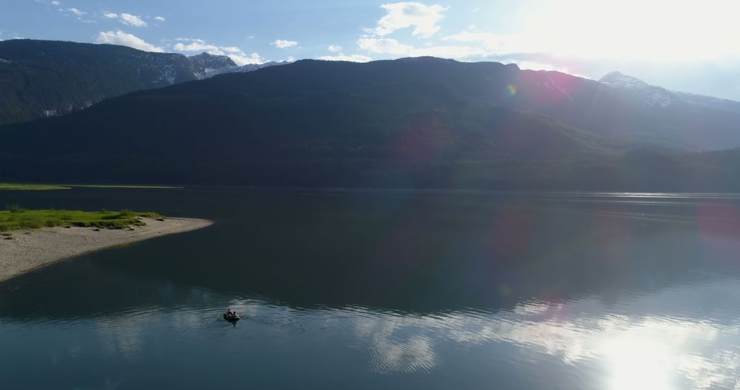 Lonely Fisherman on Serene Mountain Lake at Sunset - Free Images, Stock Photos and Pictures on Pikwizard.com