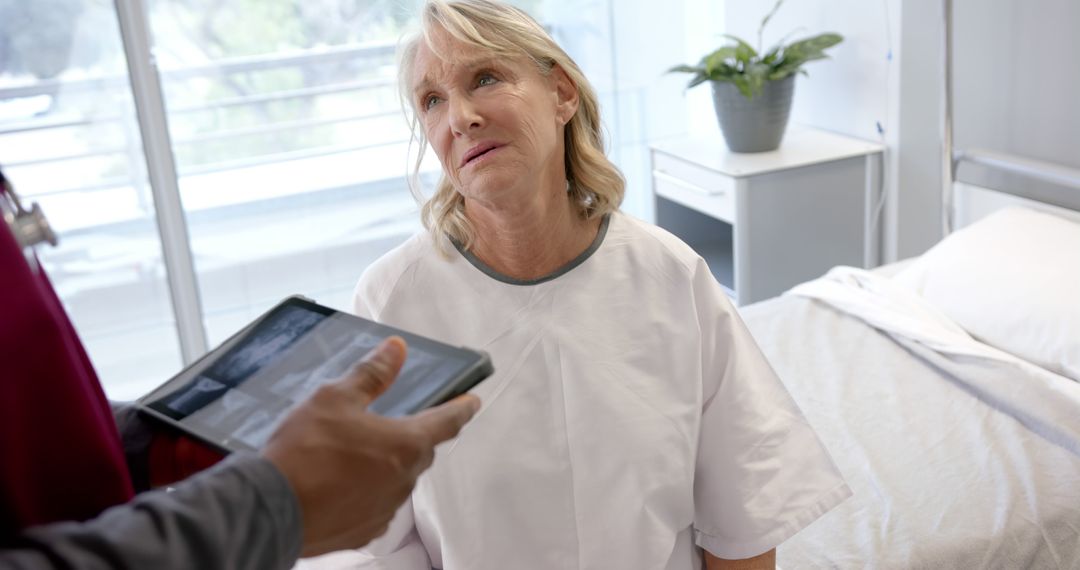 Elderly Patient Consulting with Doctor in Hospital Room - Free Images, Stock Photos and Pictures on Pikwizard.com