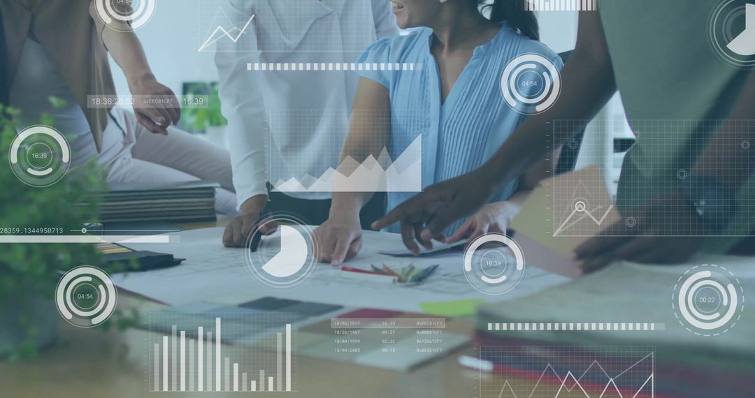 Diverse Team Analyzing Data with Digital Interfaces in Office