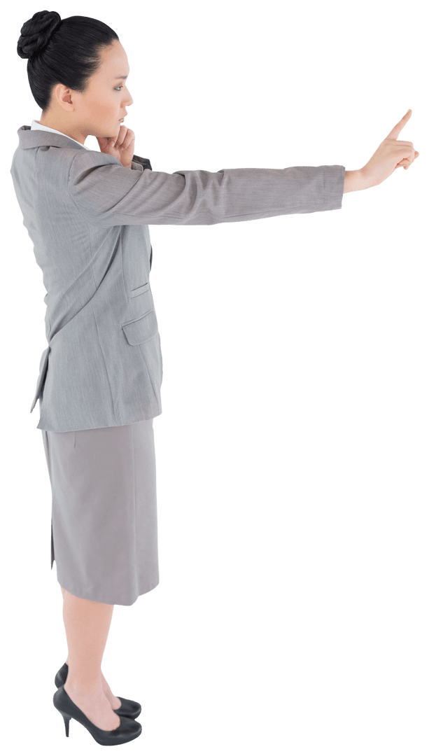 Focused Asian Businesswoman Pointing with Index Finger on Transparent Background