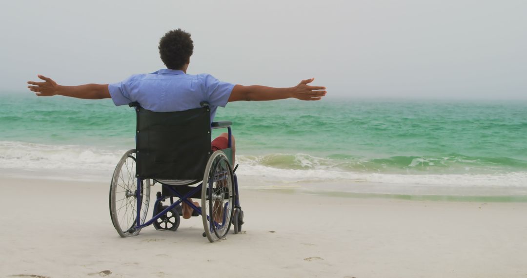 Man in Wheelchair Enjoying Tranquil Beachfront View