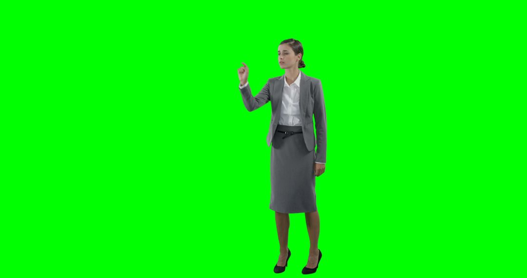 Businesswoman Interacting in Virtual Space with Green Screen Background - Free Images, Stock Photos and Pictures on Pikwizard.com