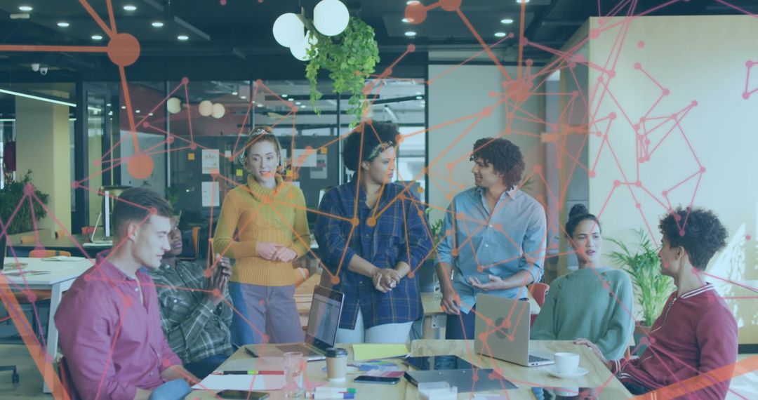 Diverse Team Discussions in Modern Office with Digital Graphics