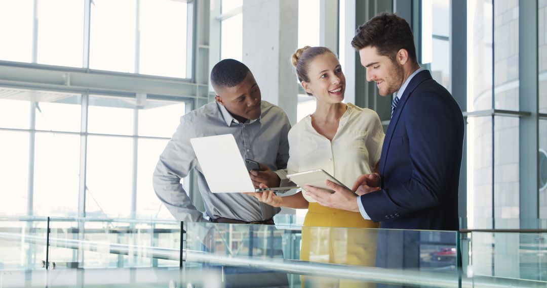 Team Collaborating on Business Project with Technology in Modern Office
