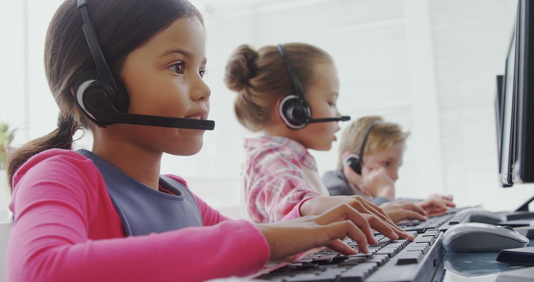 Children Working in Call Center with Headsets and Computers - Free Images, Stock Photos and Pictures on Pikwizard.com