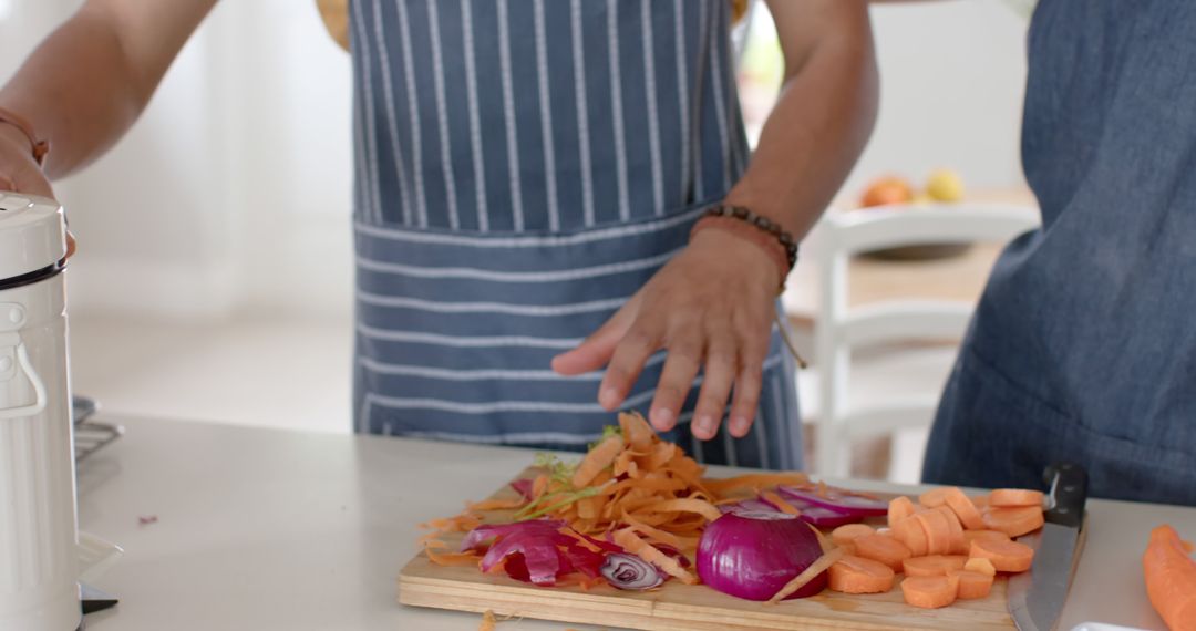 Man Prepping Vegetables in Kitchen While Practicing Zero Waste