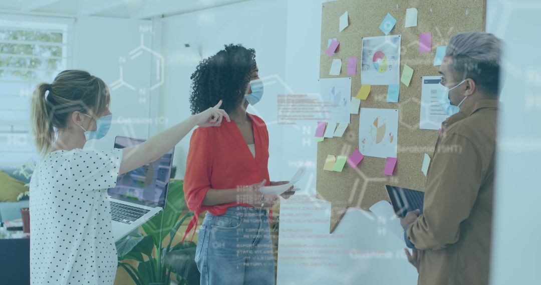 Team Collaborating with Futuristic Digital Interface in Office During Pandemic