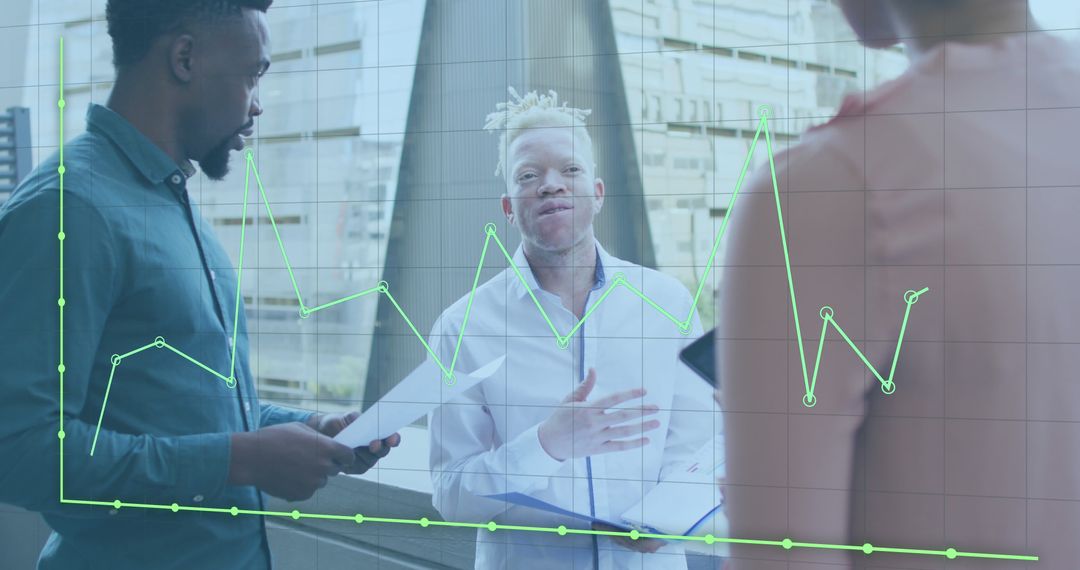 Diverse Team Discussing Data Visualizations in Modern Office