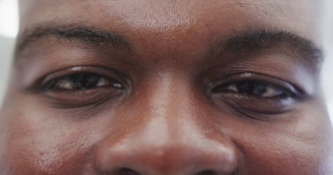 Close-Up of Positive African American Male Eyes and Forehead - Free Images, Stock Photos and Pictures on Pikwizard.com