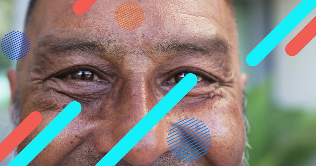 Smiling mature man showing expressive wrinkles and stubble with colorful graphic overlays