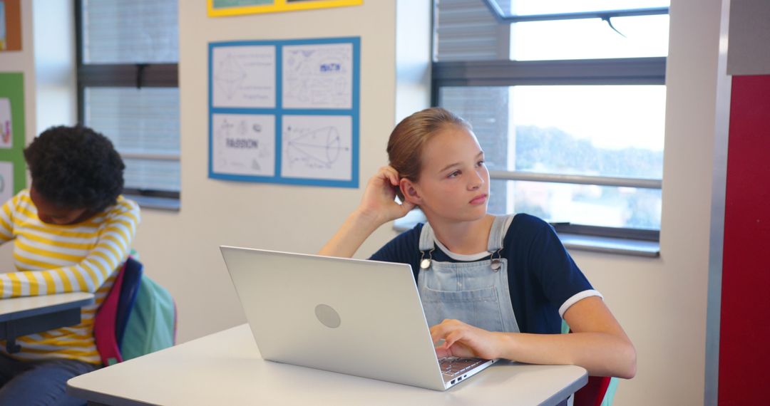 Diverse Schoolmates Engaging with Technology in Classroom setting