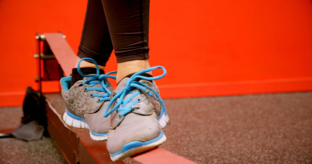 Close-Up of Woman Balancing on Beam in Fitness Studio