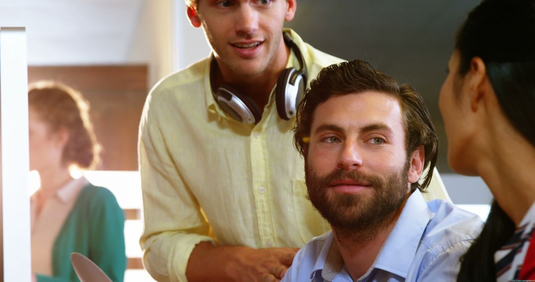 Colleagues Communicating in Modern Office Environment