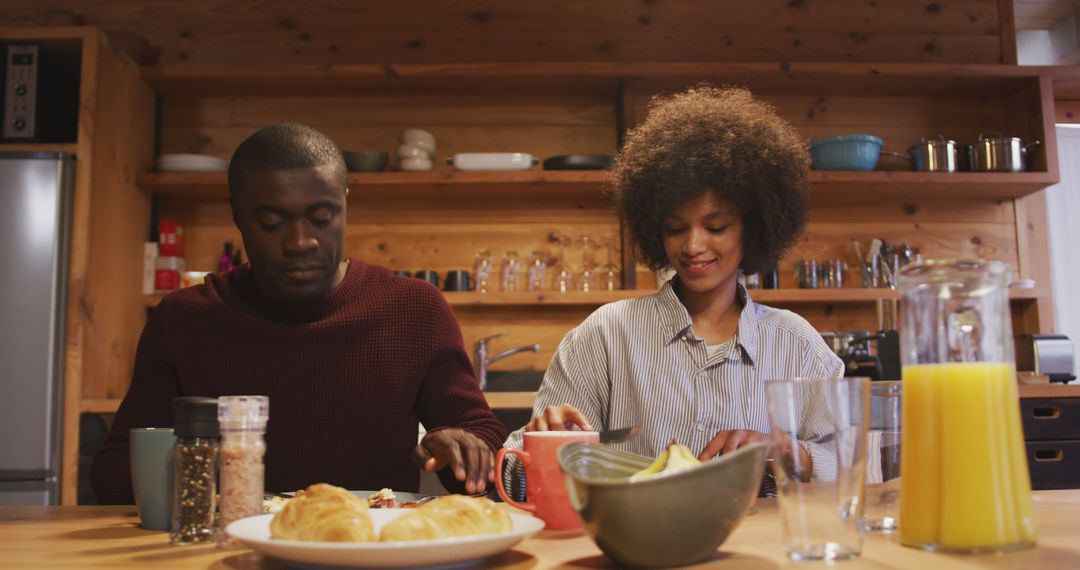 Couple Enjoying Breakfast in Cozy Home Kitchen