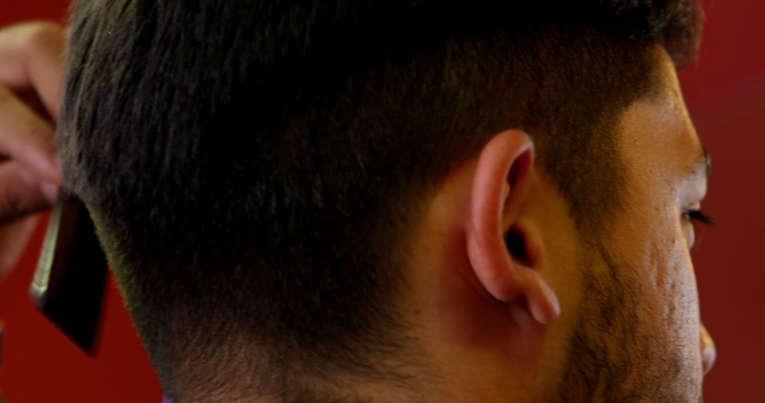 Close-up of Barber Giving Haircut to Customer with Clipper - Free Images, Stock Photos and Pictures on Pikwizard.com