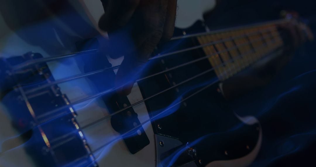 A digitally generated image captures a bass guitarist in action under dynamic blue lighting. - Free Images, Stock Photos and Pictures on Pikwizard.com