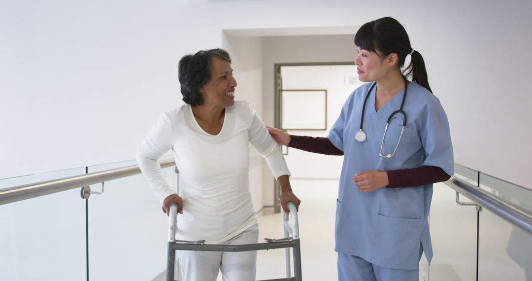 Nurse Assisting Senior Woman with Walker in Hospital Corridor - Free Images, Stock Photos and Pictures on Pikwizard.com