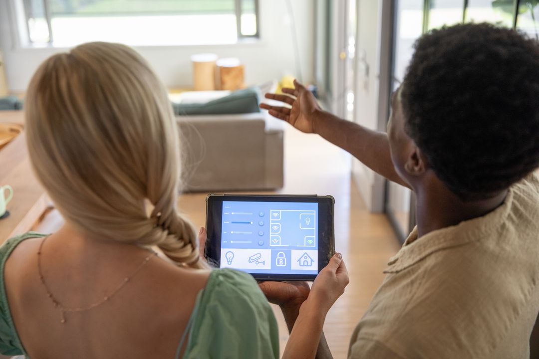 Diverse Couple Exploring Smart Home System on Tablet