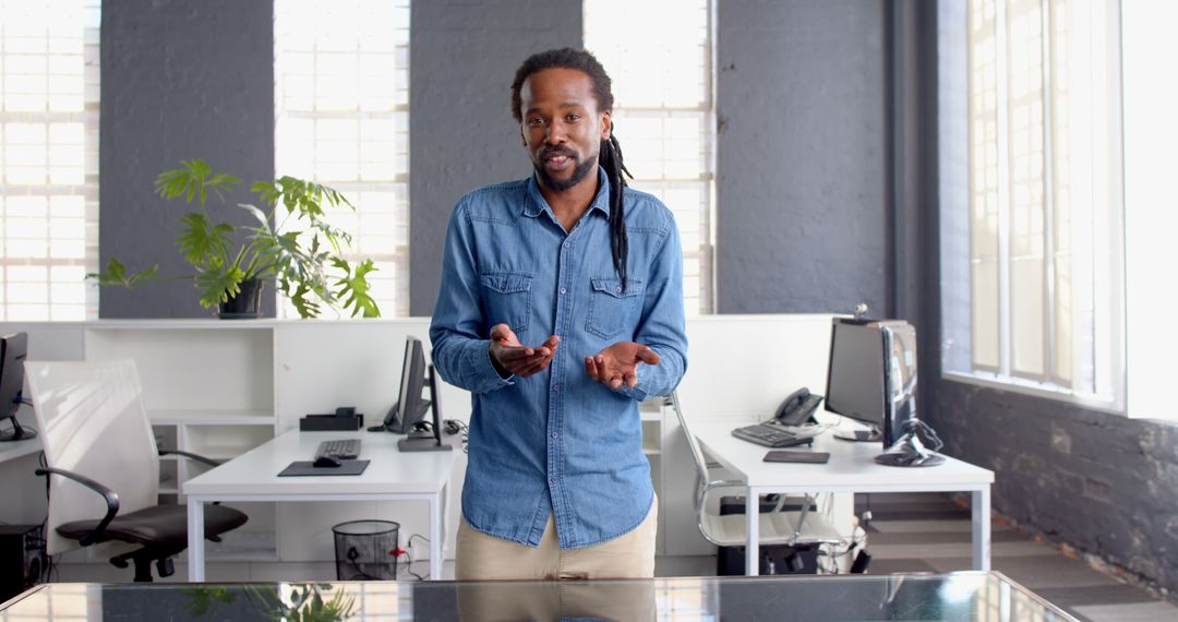 Confident Businessman Speaking in Modern Office Environment