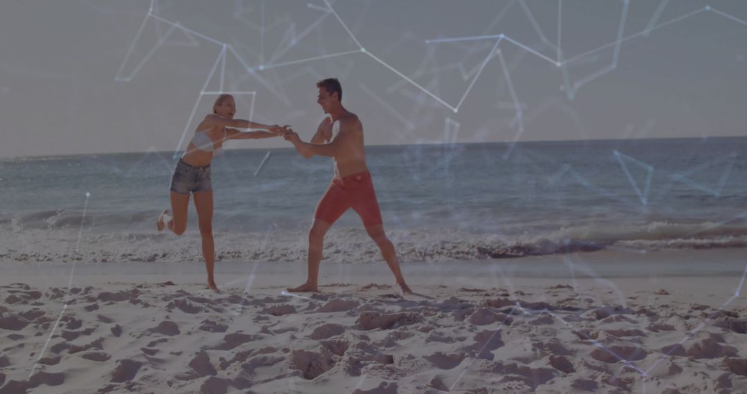 Couple Playing on Beach Overlaid with Digital Connection Networks