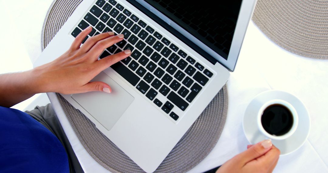 Person Working on Laptop with Coffee Mug on Desk - Free Images, Stock Photos and Pictures on Pikwizard.com