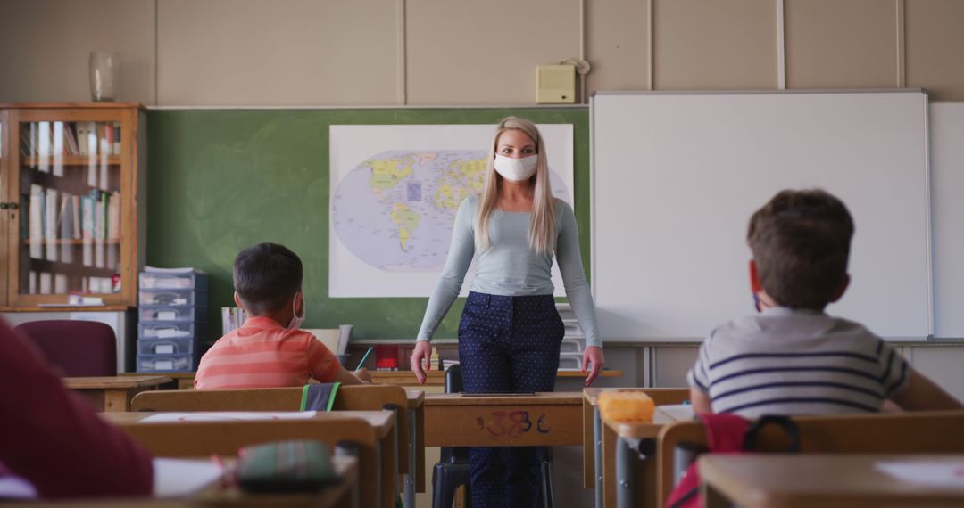 Teacher Wearing Mask In Classroom With Students During COVID-19 Pandemic - Free Images, Stock Photos and Pictures on Pikwizard.com