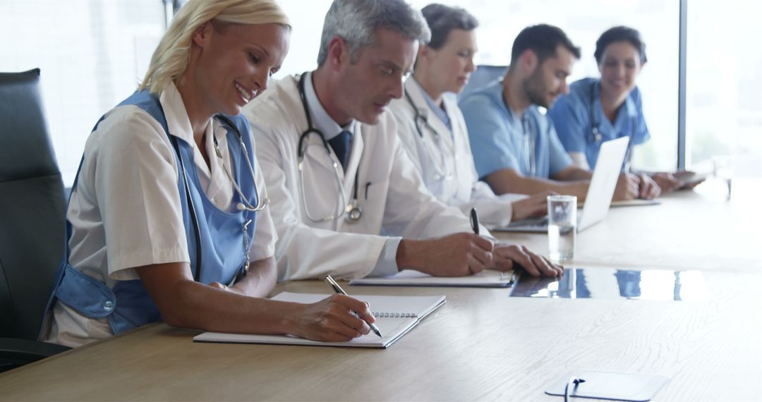 Medical Team Discussing Strategies During Meeting in Conference Room - Free Images, Stock Photos and Pictures on Pikwizard.com