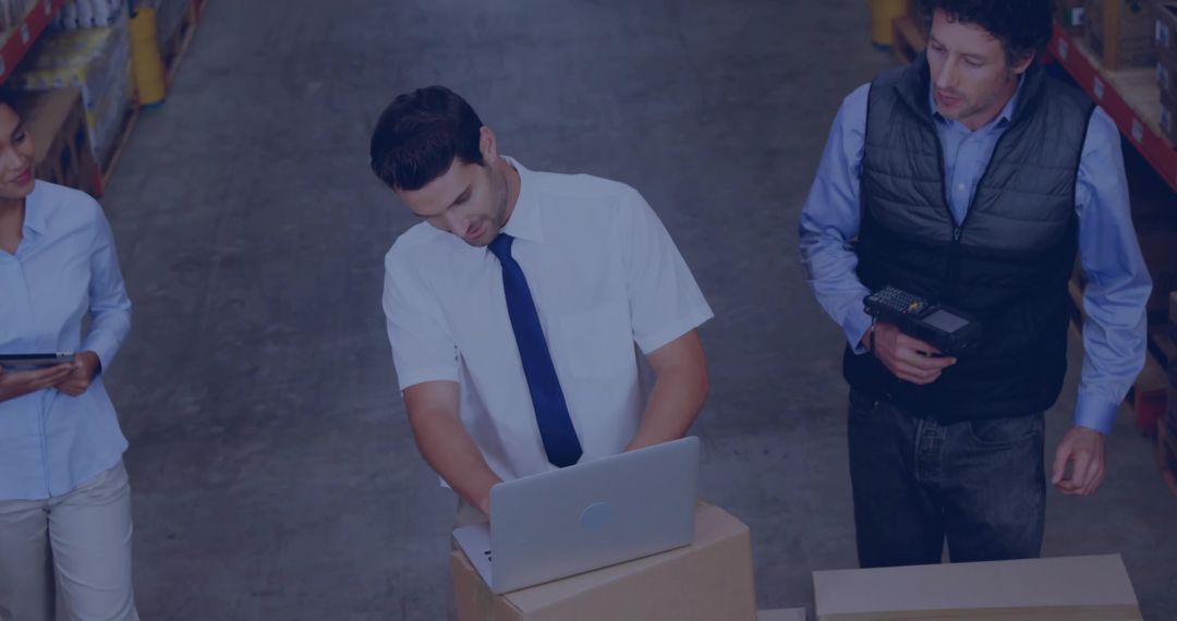 Warehouse Team Collaborating on Logistics with Digital Tools