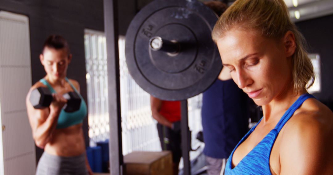 Woman Lifting Weights in Gym with Trainer - Free Images, Stock Photos and Pictures on Pikwizard.com