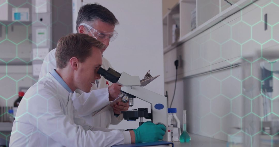 Scientists Conducting Microscope Research in Modern Laboratory