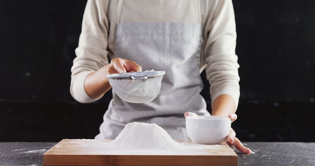 Person Sifting Flour with Sieve in Kitchen - Free Images, Stock Photos and Pictures on Pikwizard.com