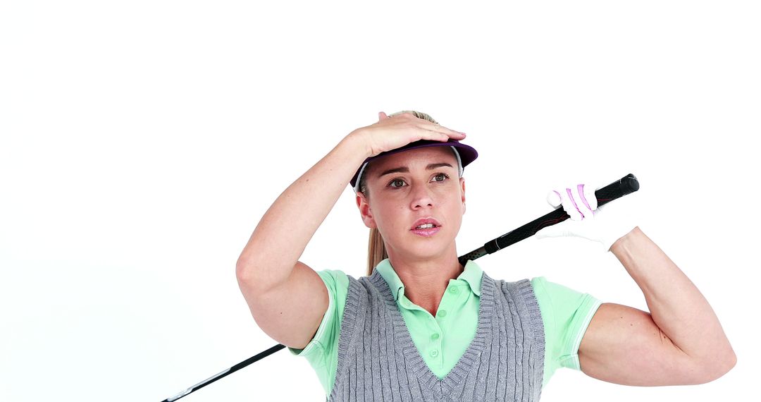 Female Golfer Looking Ahead While Holding Golf Club - Free Images, Stock Photos and Pictures on Pikwizard.com