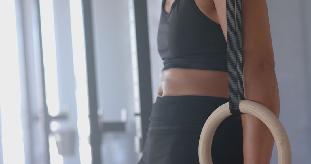 Strong Athlete Training with Gymnastic Rings in Modern Gym