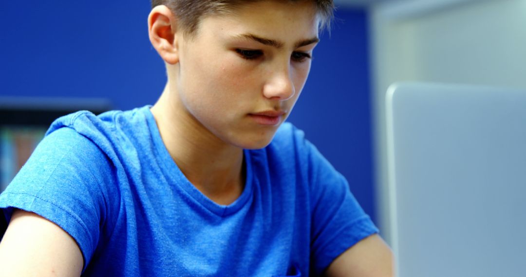 Focused Student Learning on Laptop in Classroom Setting