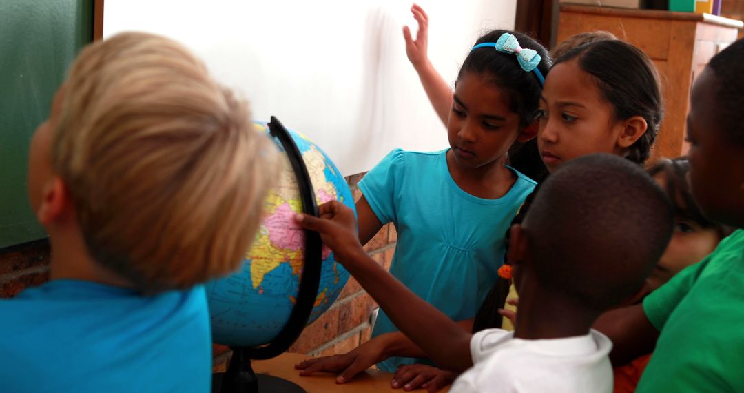 Students Learning Geography Together by Examining Globe in Classroom - Free Images, Stock Photos and Pictures on Pikwizard.com