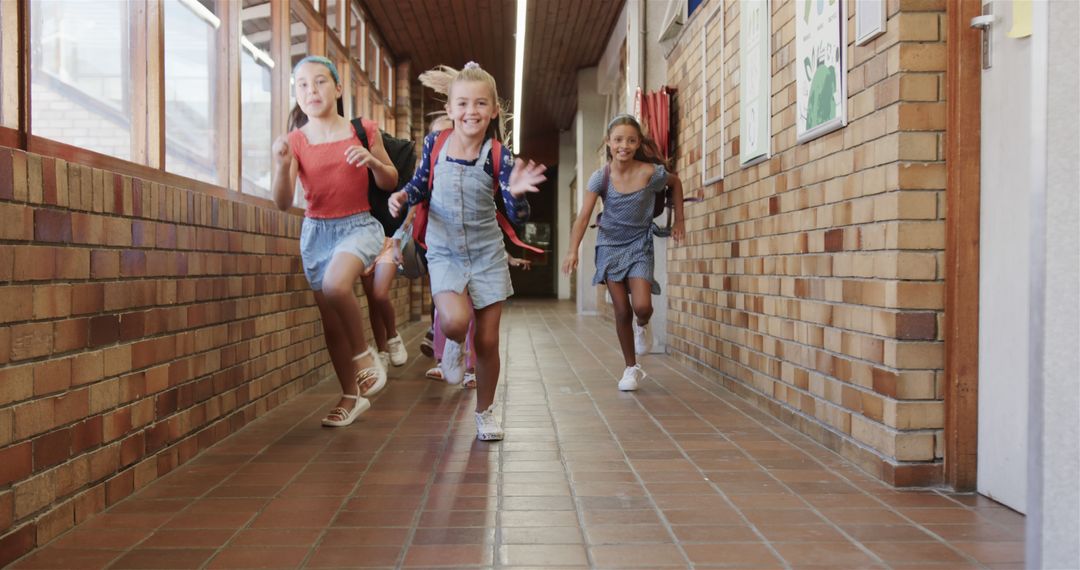 Joyful Students Running in School Hall
